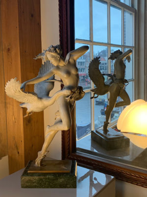 A sculpture of Michael Parkes Night Flight in a room